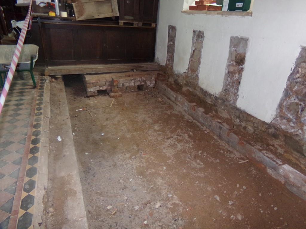 Inside Church - south side of aisle, looking towards vestry.  Bricks are site of old coke heating stove